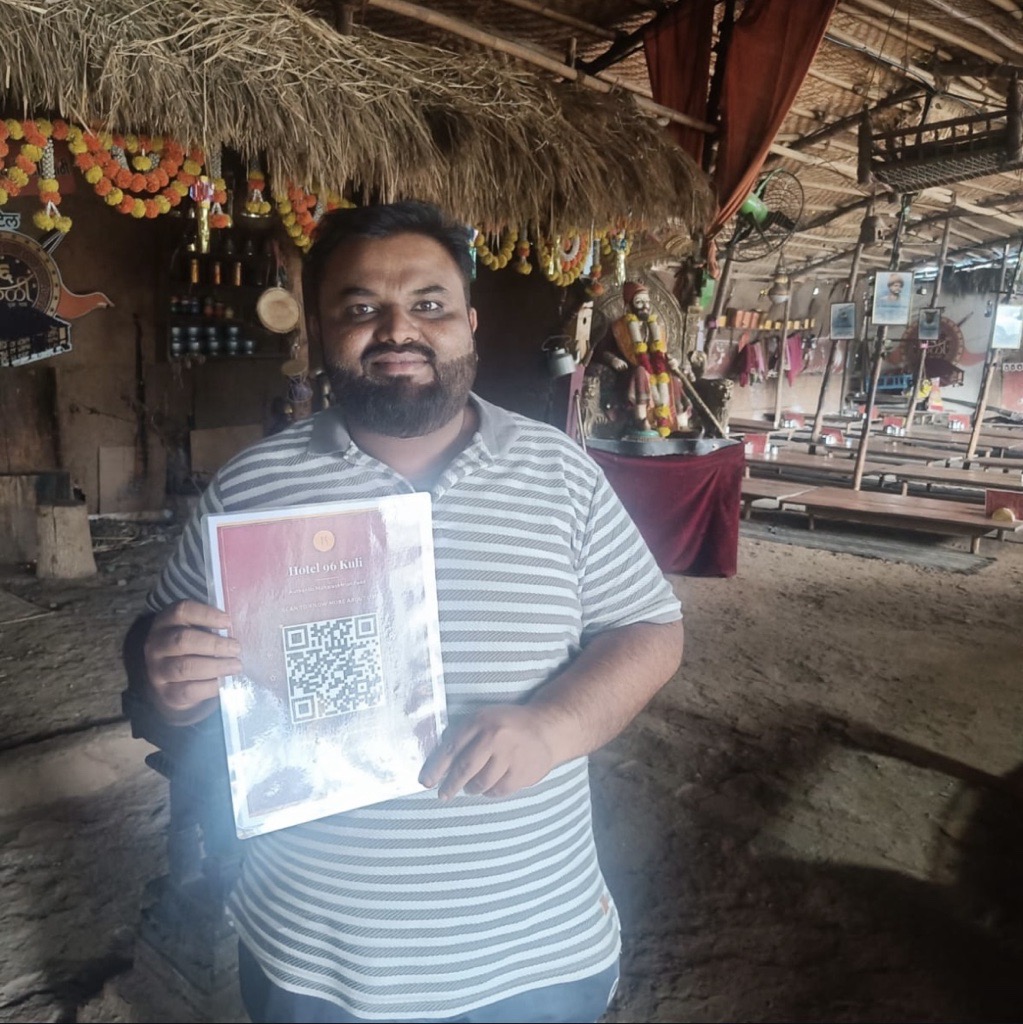 Hotel 96 Kuli Ak Gav owner with ReviewLoop QR stand